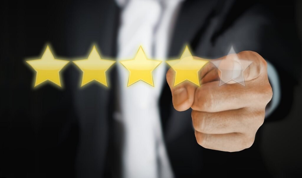 man pointing to Google business profile review stars